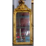 A large gilt framed bevelled glass mirror, 83 x 156cm.