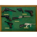 A collection of miniature replica guns, frame size 36 x 25cm.