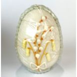 A mid 20th century worked sugar egg, with original box, H. 11cm.