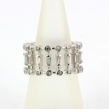 A 925 silver three tiered full eternity ring set with round and baguette cut cubic zirconia's, (N).