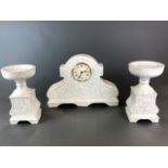 Three piece porcelain clock garniture with quartz movement, clock size 40 x 28cm.