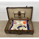 An early 20th century leather suitcase, 66 x 37 x 20cm, containing three original WWII propaganda