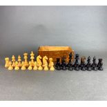 A boxwood chess set, king H. 7.5cm.
