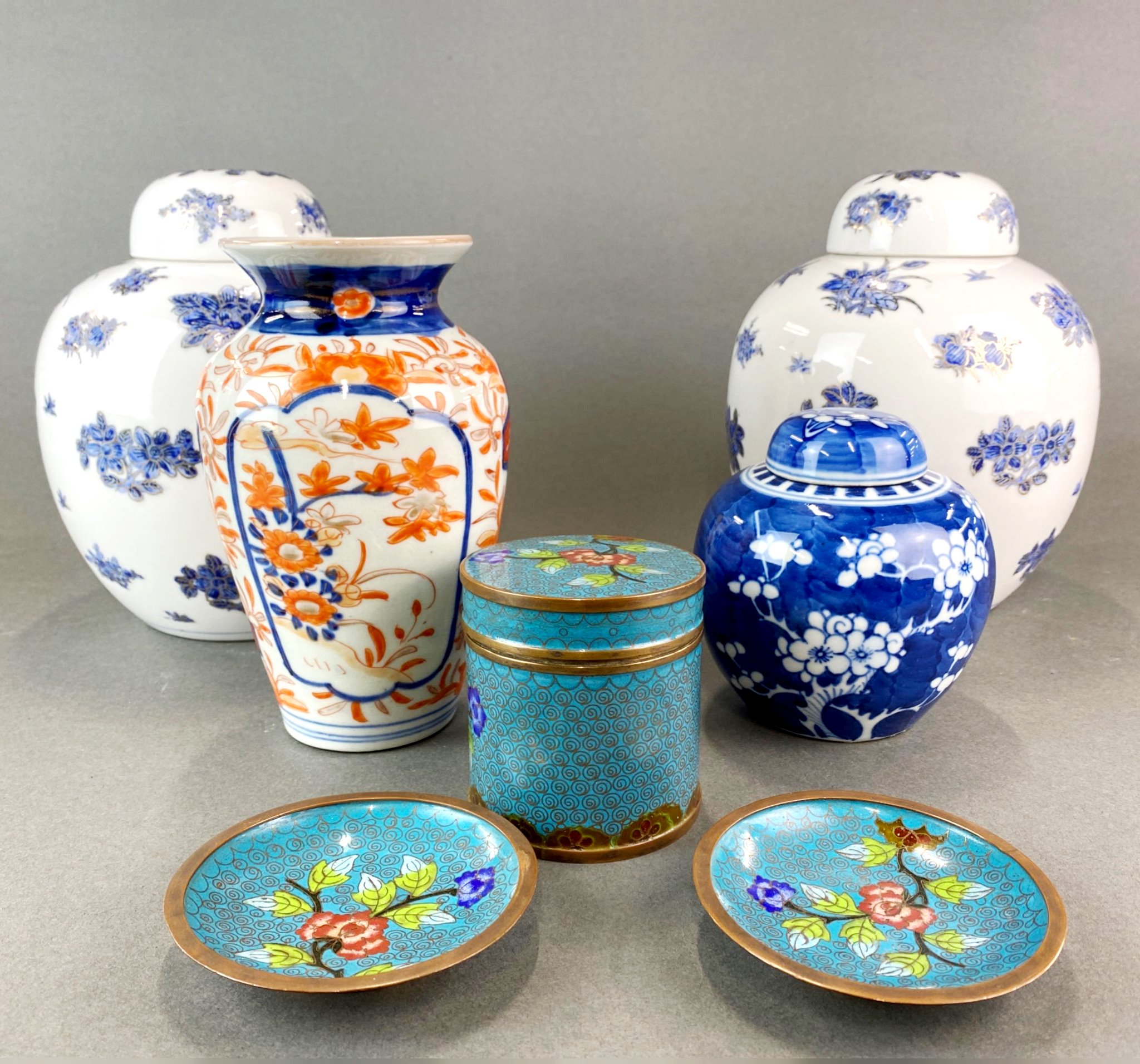 A pair of Chinese porcelain ginger jars together with three cloisonne items and two others.