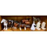 Two Beswick horses and a group of others including a cast iron doorstop and onyx book ends.