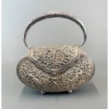 An Eastern hammered white metal (tested silver) hand bag, W. 18 x 9 x 18cm.