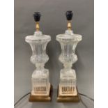 A pair of mid 20th century glass and gilt metal table lamps, H. 60cm.