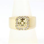 A gent's heavy 18ct yellow gold ring set with an emerald cut diamond surrounded by brilliant cut