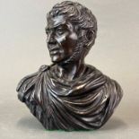 A signed 19th/early 20th Century bronze bust of a Roman Emperor, H. 21cm.