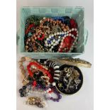 An extensive box of mixed costume jewellery.
