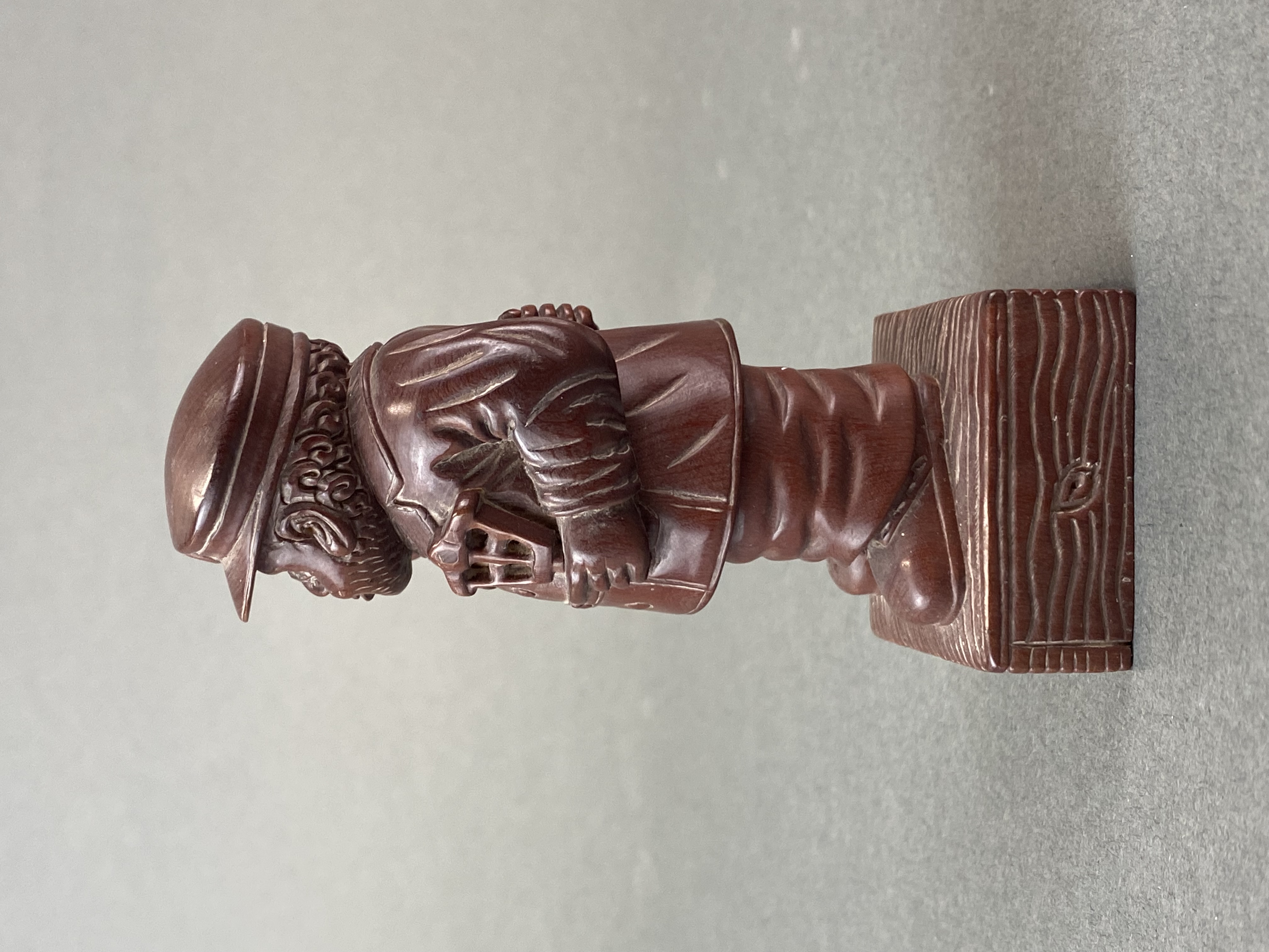 A carved fruitwood figure of a bearded gentleman smoking a pipe, H. 10cm. - Image 2 of 4