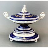 A Continental porcelain centrepiece/serving tureen and lid with elevated base, W. 40cm. H. 36cm.
