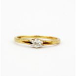 An 18ct yellow gold solitaire ring set with an old brilliant cut diamond, (P).