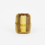 An 18ct yellow gold ring set with a large emerald cut citrine, 2 X 1.5cm, (O).