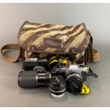 A Nikon FG single lens reflex camera with a Nikon series E lens.