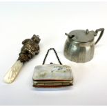 A white metal and mother of pearl cat baby rattle with a mother of pearl purse and a pewter