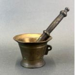 A bronze pestle and mortar, Dia. 11cm. H. 8cm.