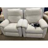 A pair of almost new electric recliner armchairs.