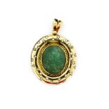 A large and heavy hallmarked 18ct yellow gold pendant, L. 5cm, set with a large hand carved emerald,