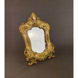 An ornate gilt metal free standing mirror, H. 30cm.