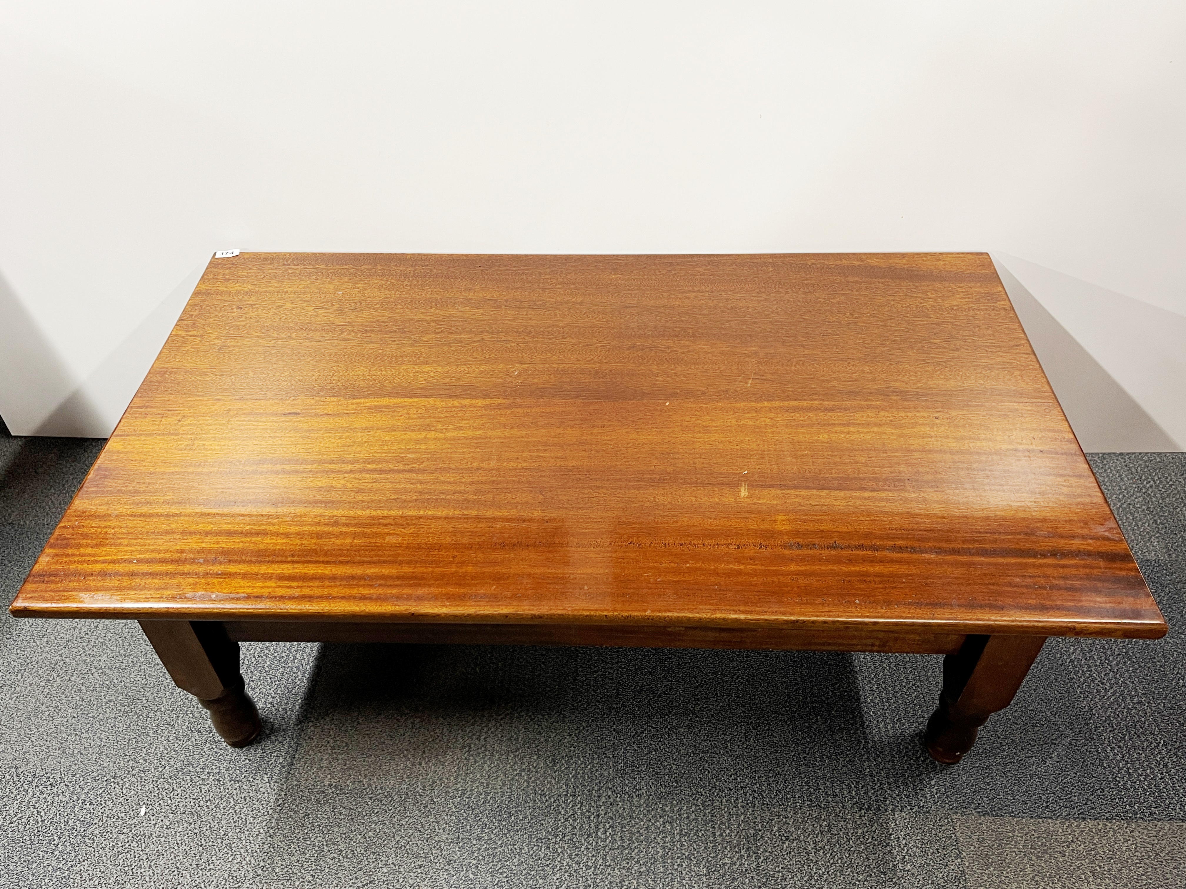 A handmade mahogany coffee table, 75 x 133 x 48cm.
