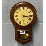 A small oak cased wall clock, dia. 20cm.