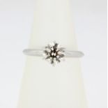 A Tiffany style 18ct white gold brilliant cut diamond solitaire ring, (M.5). Approx. 1.09ct.
