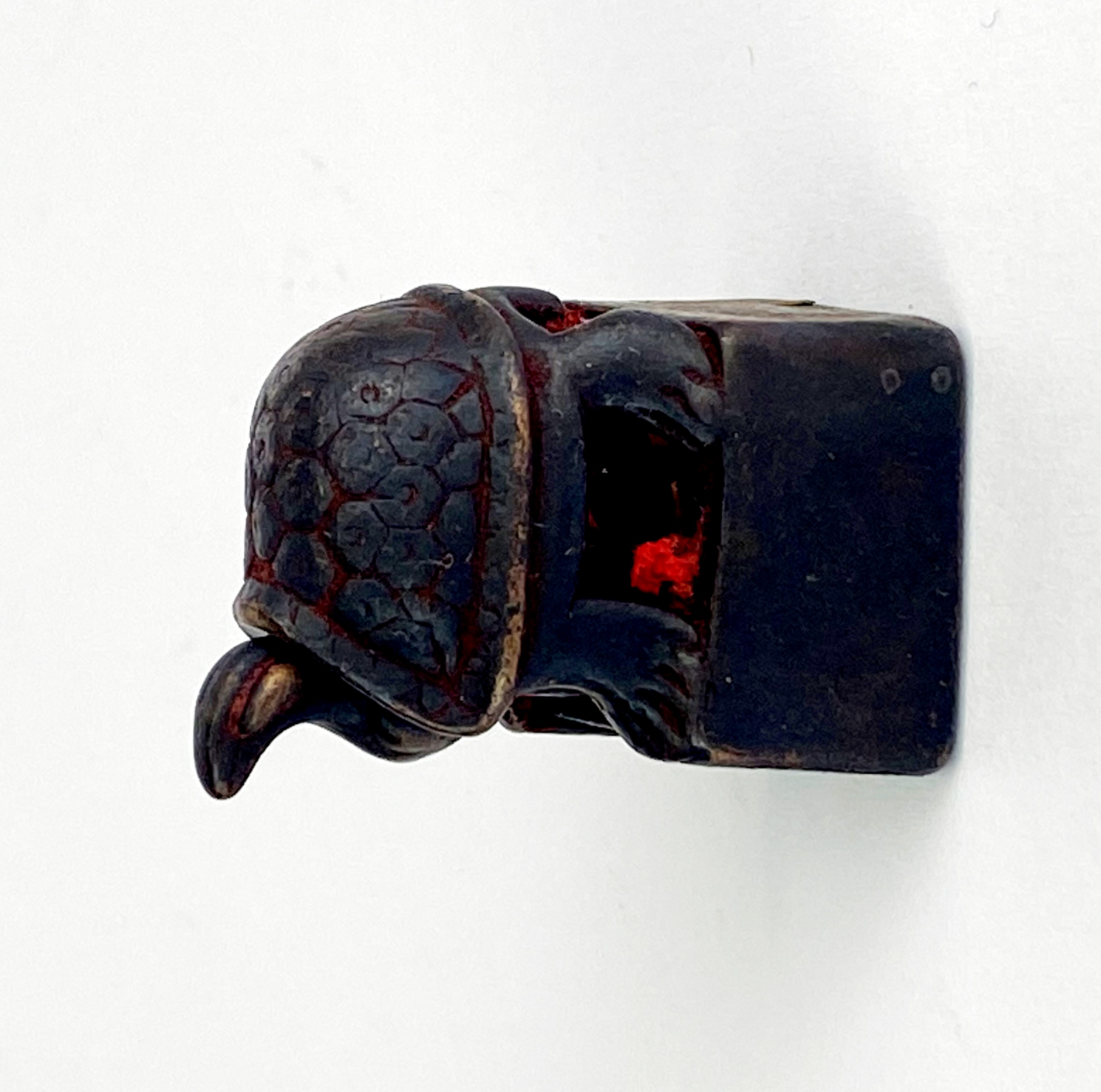 A small Chinese bronze double seal mounted with a tortoise, 3 x 2 x 2cm.