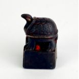 A small Chinese bronze double seal mounted with a tortoise, 3 x 2 x 2cm.