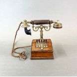 An early house telephone with five selection switches, H. 23cm.