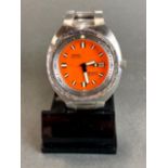 A gent's stainless steel orange faced Doxa wristwatch with box and papers. Case W. 4.5cm.