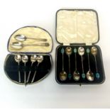 A cased set of hallmarked silver coffee beans spoons with a further six silver spoons mixed.
