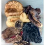 A quantity of vintage fur hats and collars.