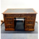 A 19th century carved oak desk, 120 x 65 x 77cm.