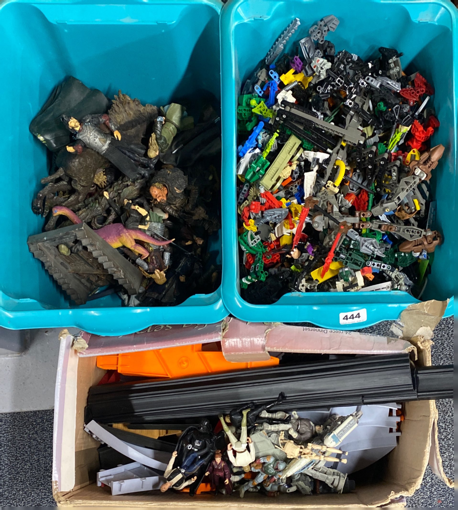 A quantity of transformer models with a quantity of Lord of the rings figures and other items.