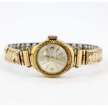 A lady's 9ct yellow gold wrist watch with gilt expandable strap.