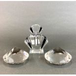 An Art Deco style perfume bottle, H. 12cm, and two faceted crystals, dia. 10cm.