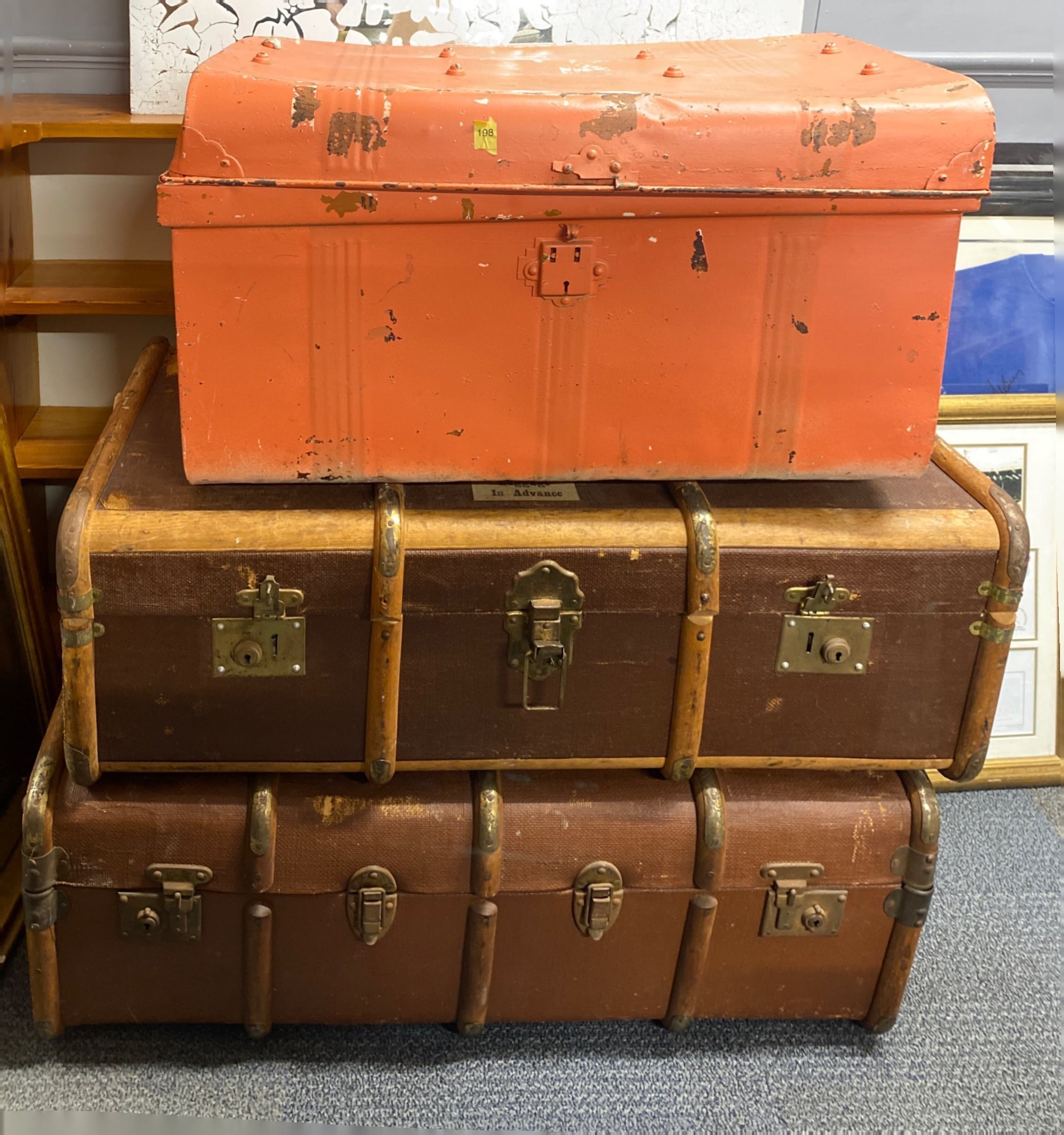 Two vintage wood and canvas cabin trunks and one tin trunk, largest 90 x 53 x 33cm.