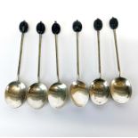 A set of six Art Deco hallmarked silver coffee bean spoons.