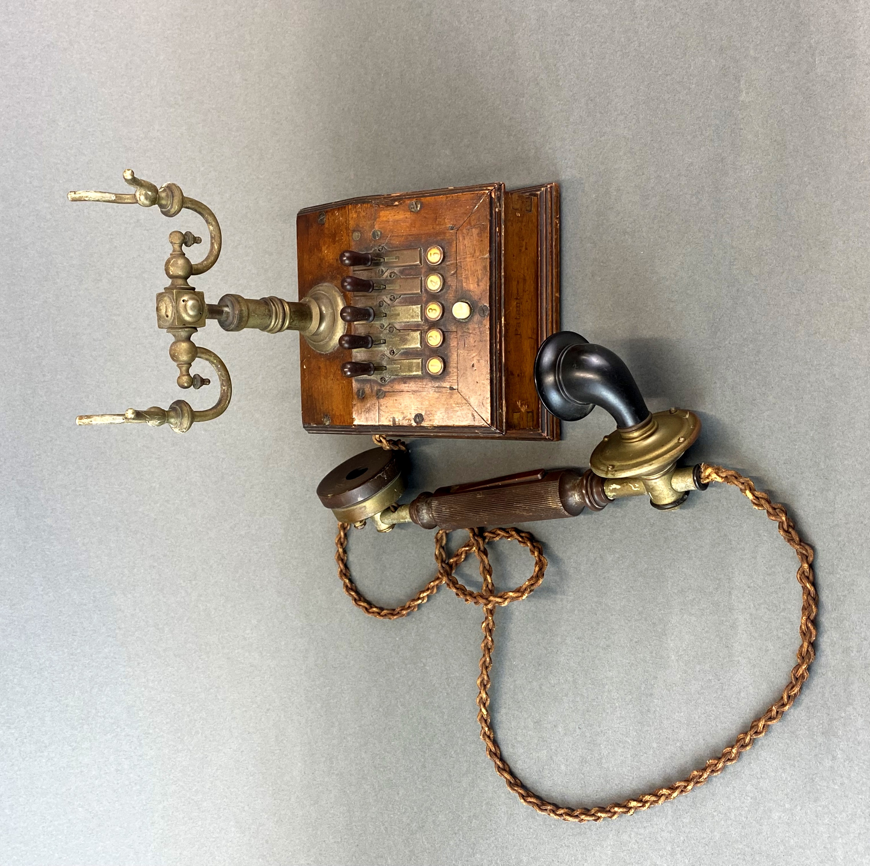 An early house telephone with five selection switches, H. 23cm. - Image 3 of 3