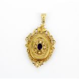 An antique 9ct yellow gold locket pendant set with an oval cut amethyst and seed pearls, L. 5.5cm.