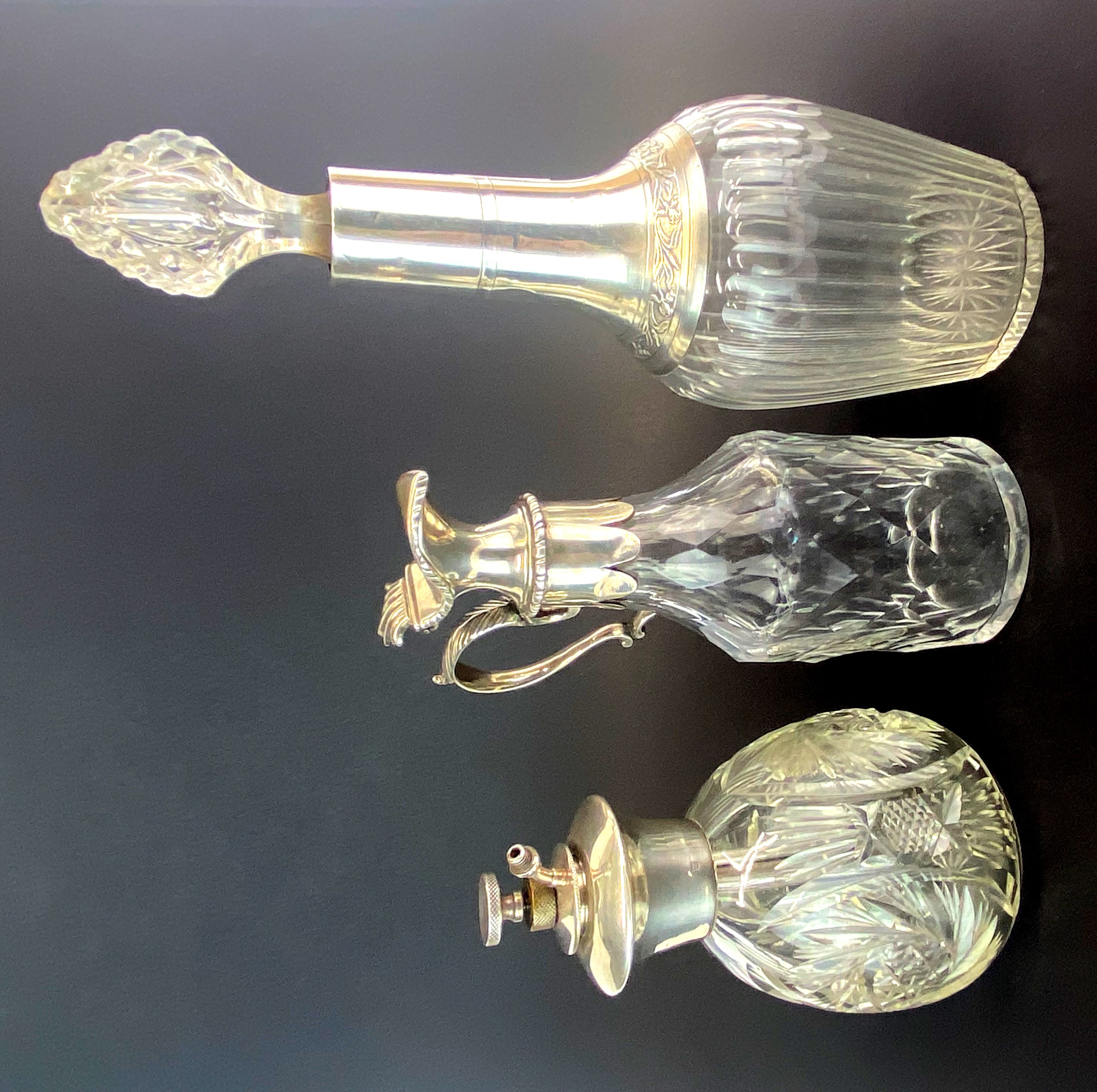 A 1930's sterling silver topped perfume atomiser together with a white metal (tested silver)