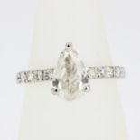 A platinum ring set with a large pear cut diamond, approx. 1.51ct, (O.5).