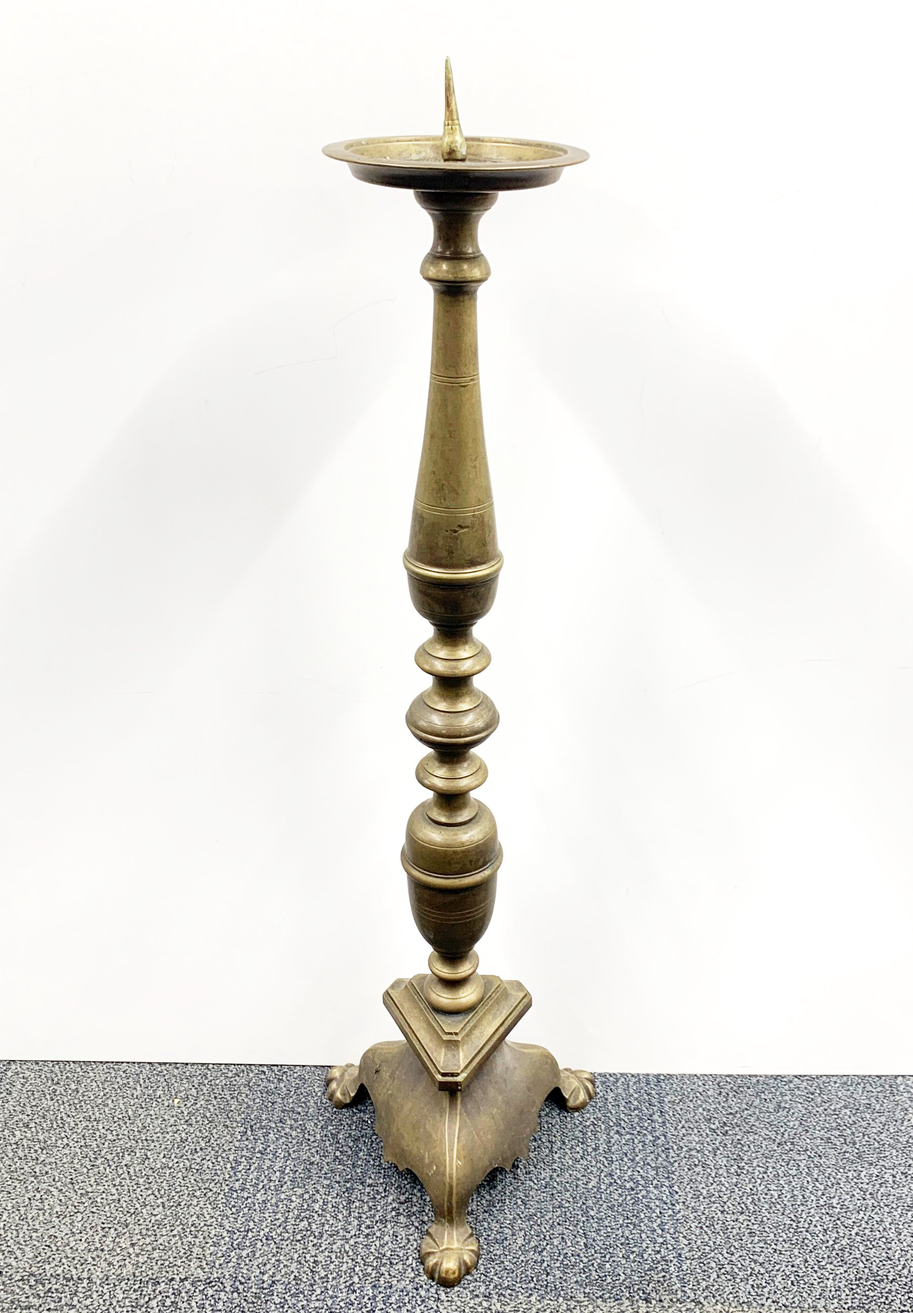 A large 19th century church brass pricket candlestick, H. 106cm.