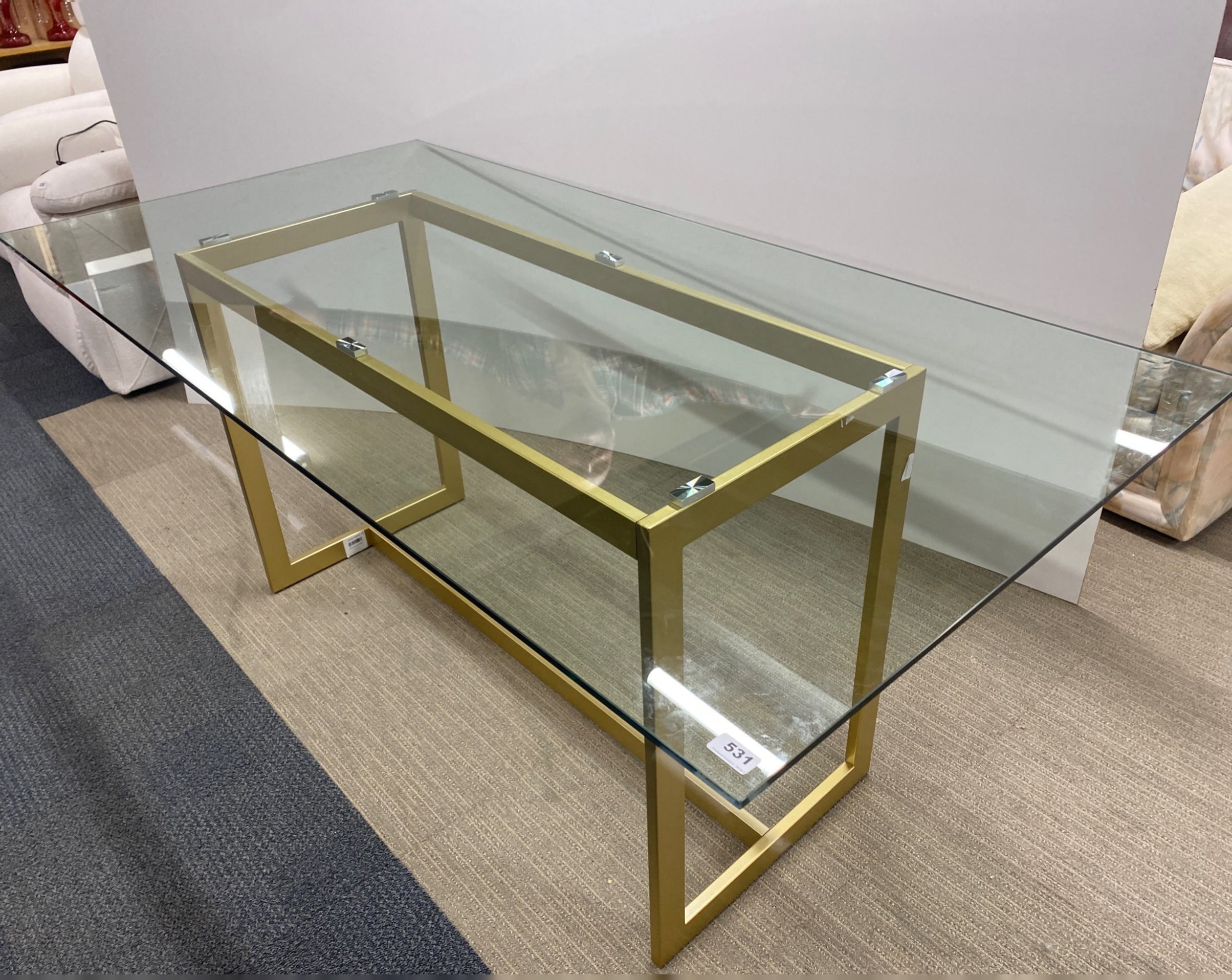 A contemporary heavy plate glass top and gilt metal base dining table, 180 x 90cm. - Image 2 of 2