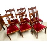 A set of six Edwardian mahogany dining chairs.