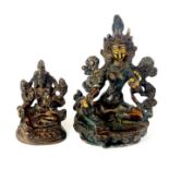 Two Tibetan bronze figures of seated deities, tallest H. 10cm.