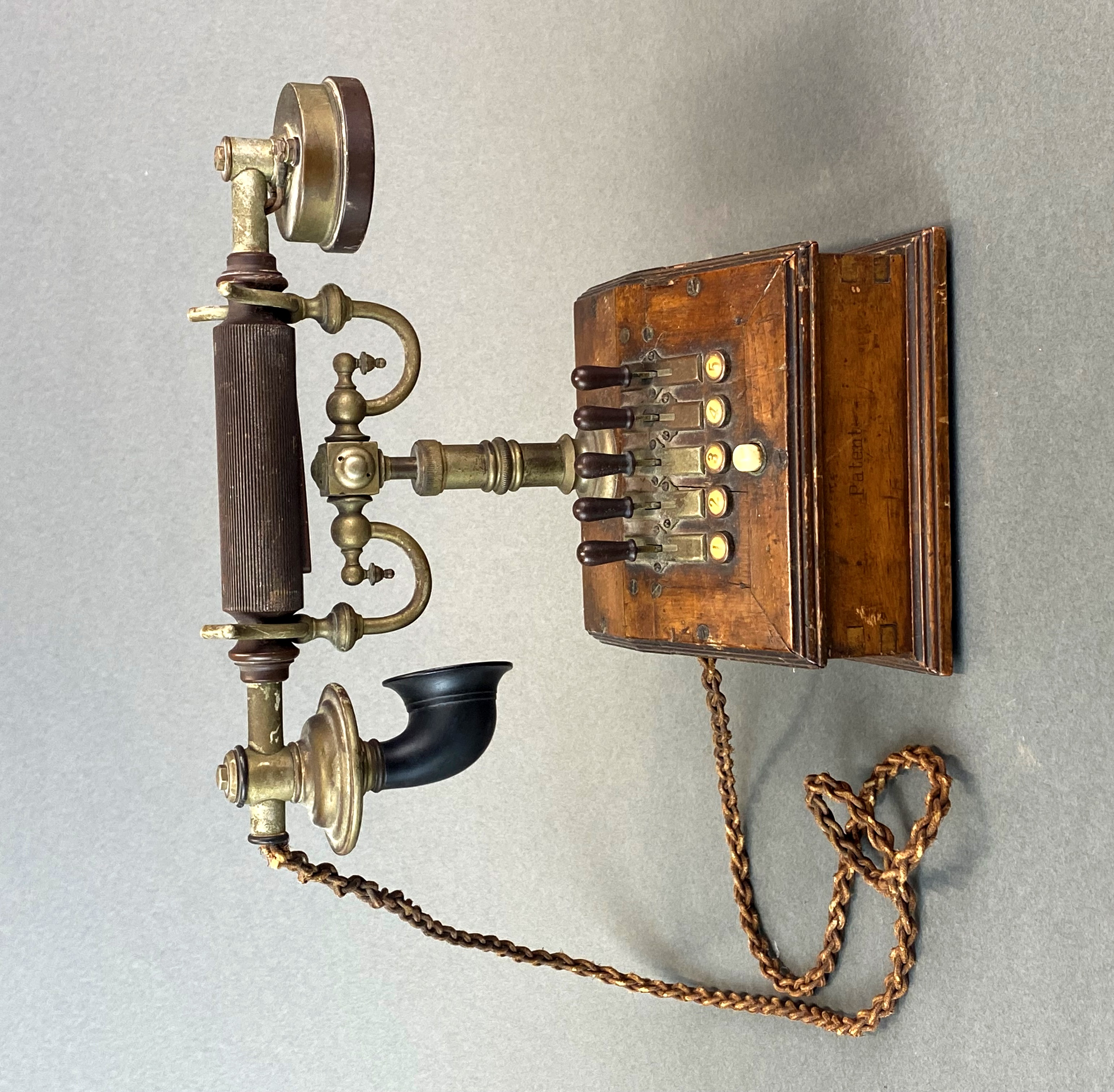 An early house telephone with five selection switches, H. 23cm. - Image 2 of 3