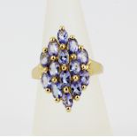 A 925 silver gilt ring set with oval cut tanzanites, approx. 3.25ct total, (O). With certificate.