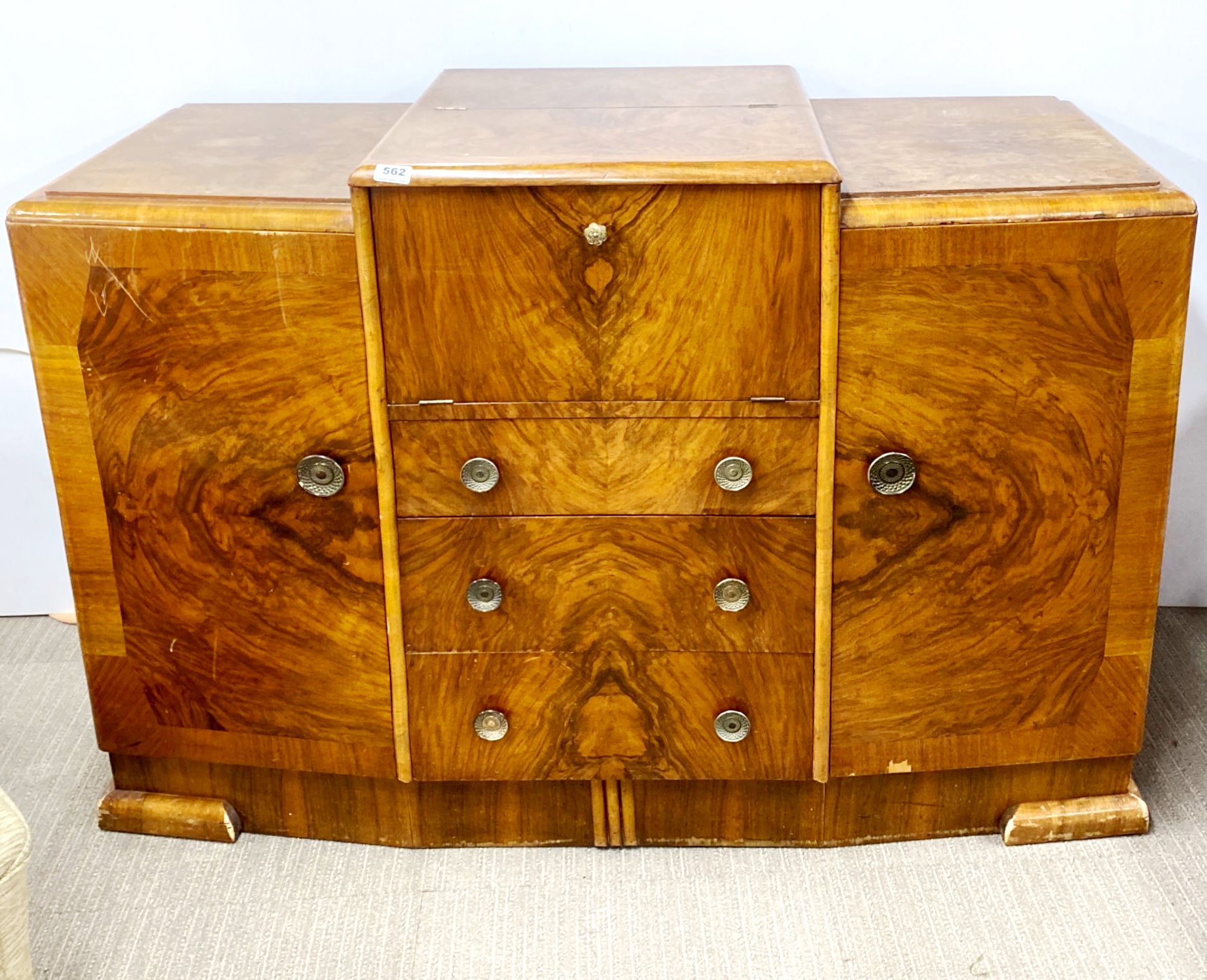 An Art Deco walnut veneered drinks cabinet sideboard, W. 136cm, H. 96cm.